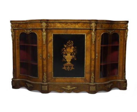 A Victorian marquetry inlaid walnut credenza, ormolu mounted, the central cupboard door inlaid with a vase of flowers, flanke