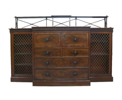 A Regency mahogany breakfront secretaire bookcase, ebony strung, the superstructure with turned supports and leather skiver, 