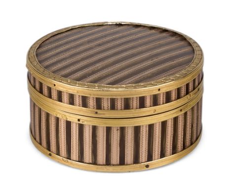 A French gold inlaid tortoiseshell snuff box, c.1790, decorated with rose gold bands, French guarantee marks, 4.6cm diameterP