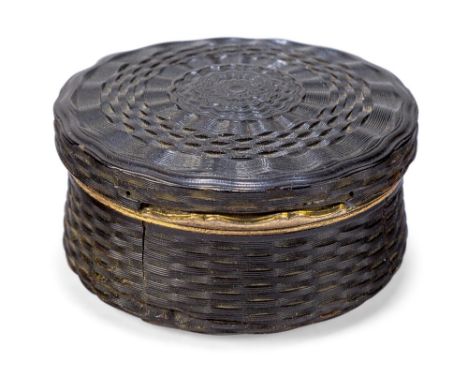 A gilt-brass mounted tortoiseshell snuff box, late 18th / early 19th century, of circular form with engine turned decoration,