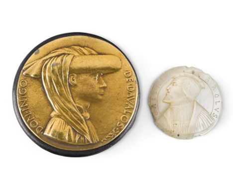 A mother of pearl portrait medallion of Charles V, possibly 16th century, inscribed CAESAR CAROLVS, on a modern perspex stand