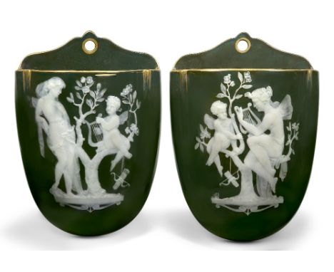 A pair of George Jones olive-brown porcelain pate-sur-pate wall pockets, c.1885, 5653 in gilding to the reverse, attributed t