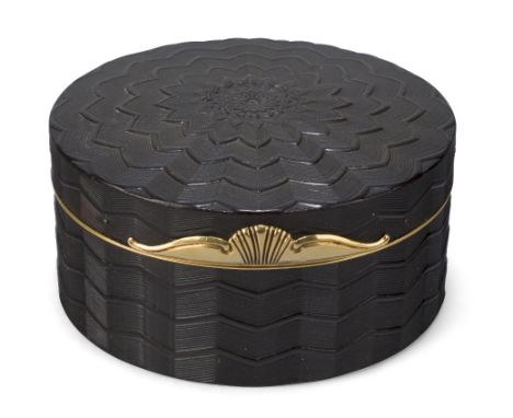A gilt-brass mounted tortoiseshell snuff box, 19th century, of circular form with engine turned decoration, with gilt-brass f