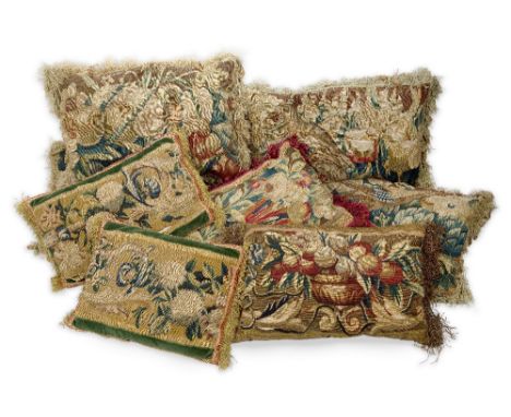 A group of eight tapestry cushions, 18th century and adapted, with fruit and flowers motifs, comprising a set of four, 33 x 4