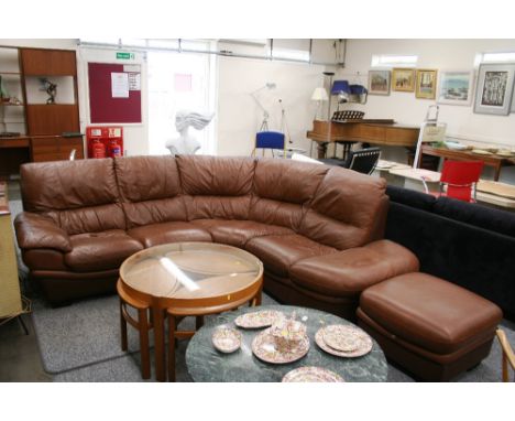 A brown leather upholstered corner settee, and matching foot stool