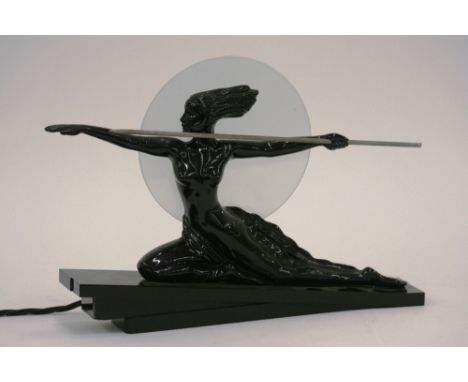 A figural table lamp, mounted with black painted model of Diana the Huntress, with circular frosted glass shade, raised on st