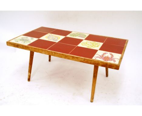 A coffee table, inset with Poole pottery tiles, 79cm x 49cm