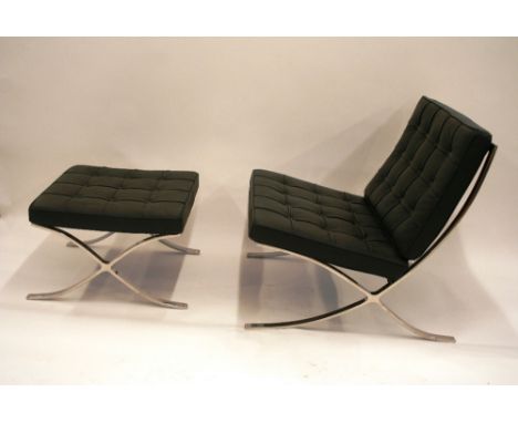 A Barcelona black leather buttoned down upholstered living chair, raised on metal X-frame support, 75cm; and matching foot st