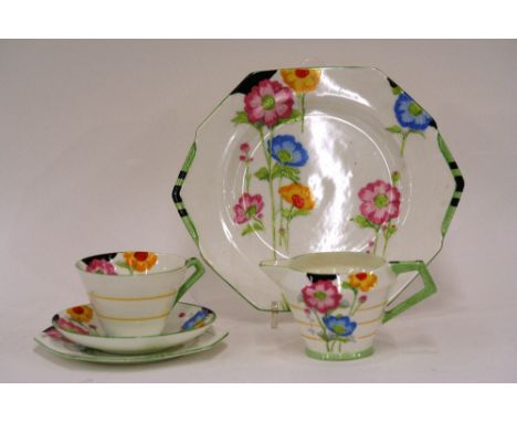 A Paragon Anemone pattern part tea service, comprising cake plate, five side plates, six cups, six saucers, cream jug and sug
