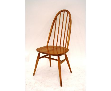 A light Ercol drop leaf table, 126cm x 113cm; and a set of six stick back chairs, 96cm high