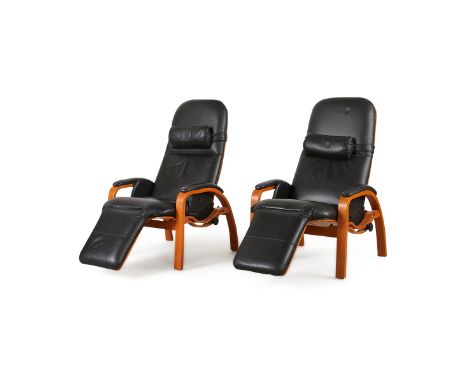 Pair of black leather zero gravity reclining easy chairs. With a label from Backsaver Products Company.Each, height: 45 in x 