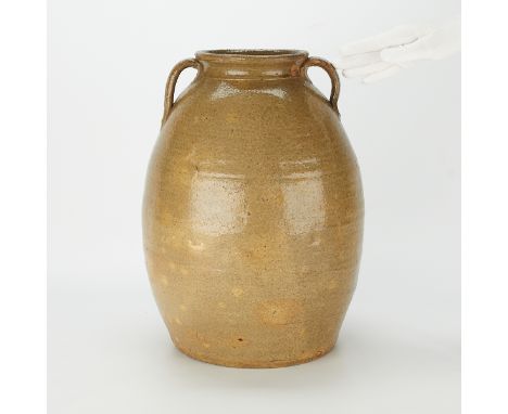 Double handled alkaline glazed stoneware storage jar from the Edgefield District in South Carolina, ca. 1850-1880. With strap