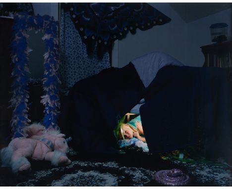 Angela Strassheim (American, b. 1969). Chromogenic color print titled "Untitled (Fort)" depicting a young child peeking out f