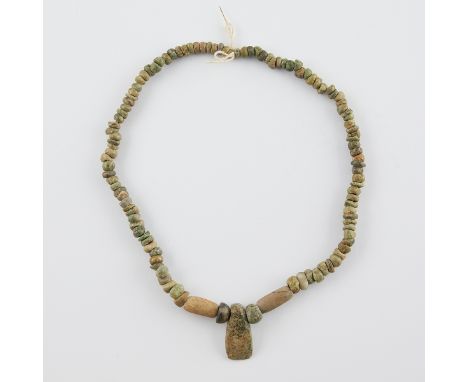 Guerrero Mezcala greenstone beaded necklace with an axe head pendant, southern Mexico, ca. 600-100 BCE.Length, approx.: 24 in