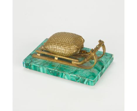 Russian inkwell in the form of a gilt bronze sleigh that carries the well. The glass inkwell is hidden within the sack along 