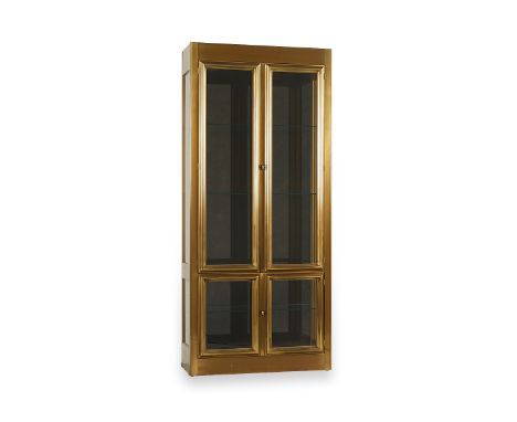 MasterCraft, United States. A brass and glass display cabinet or vitrine with smoked glass back, one of two in this auction. 