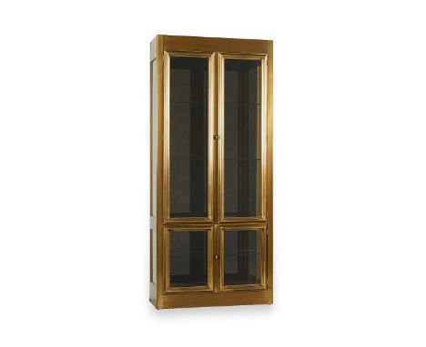 MasterCraft, United States. A brass and glass display cabinet or vitrine with smoked glass back, one of two in this auction. 