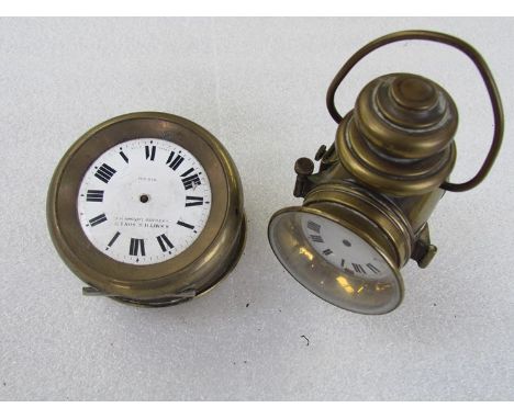 A brass clock in the form of a vintage lamp and a S. Smith & Sons Ltd dash clock - both missing hands 