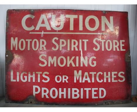 An enamel caution sign "Motor Sprit Store, Smoking, Lights or matches Prohibited"