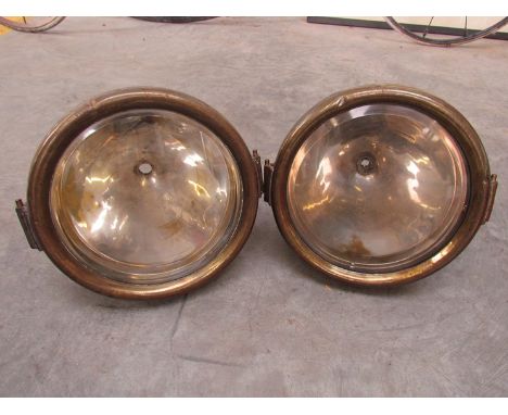 A pair of brass CAV model F lamps 