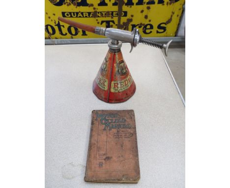 A 1930's redex oil additive hand lube gun with an early period motor cycle manual