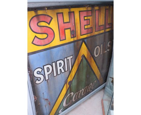 An enamel sign "Shell spirit oils Garage"