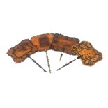 Four penwork and painted face screens and a relic condition whitewood sewing box, probably