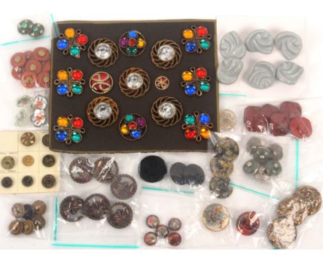 A mixed lot of buttons on cards and loose, including a marked glass Bimini, 3cms, a set of six ceramic, six stone and white m
