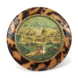 A whitewood print decorated Tunbridge ware pin cushion on ribbon suspension, in burnt wood to