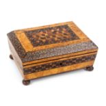 A masur birch Tunbridge ware box labelled for Fenner and Co., of sarcophagol form and raised on