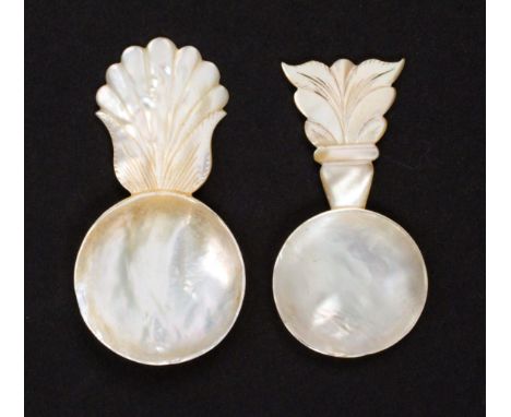 Two mother of pearl tea caddy spoons, both with circular bowls and leaf carved handles, largest 7.4cms. &nbsp; &nbsp; (2)