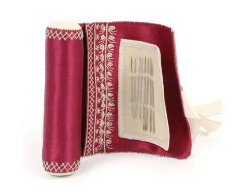 A fine bolster needle flannel, circa 1820, in plum silk, the single flannel with stitched edge over a small compartment with 