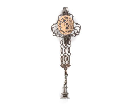 A fine gold mounted 18th Century steel chatelaine, the leaf scroll pierced steel mount with hook and enclosing a pierced oval