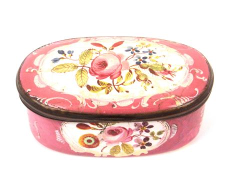A late 18th Century oval enamel box, pink ground painted with oval panel of flowers and leaves, cracks to lid, restoration to