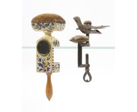 Two sewing clamps, comprising a Dutch wooden example, the frame incorporating a circular mirror below a trough form pin cushi