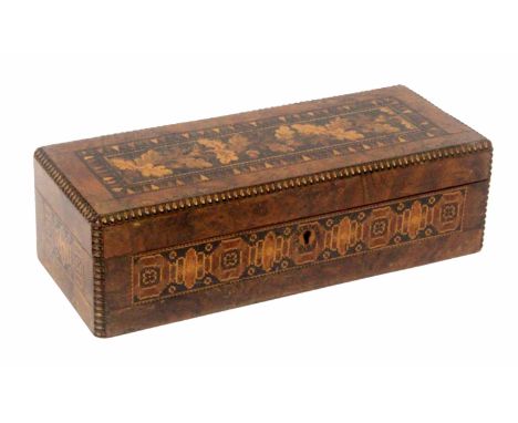 An unusual burr walnut Tunbridge ware box, of rectangular form, each side with a panel of geometric mosaic, the lid with a mo
