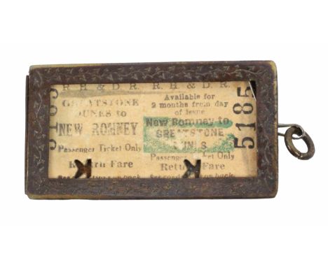An unusual Victorian brass railway ticket holder, of rectangular form inscribed 'Chapmans Patent Ticket Holder …… 1886', dent