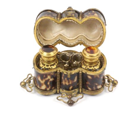 A French tortoiseshell and gilt metal mounted sewing etui and scent for a child, circa 1870, of elaborate, triple oval form o