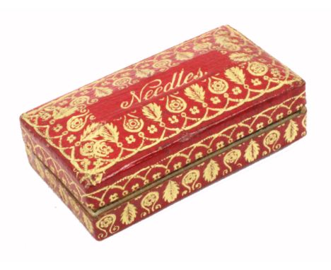 A red leather and gilt tooled rectangular needle packet box, the canted lid rising to a panel inscribed 'Needles', near mint,