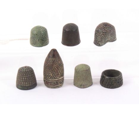 Seven 16th Century and later bronze and other metal thimbles, including a pointed Hispano Moresque example with script border