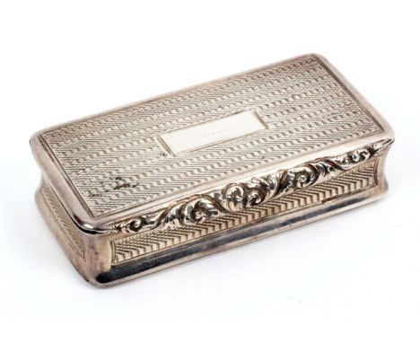 A Georgian silver snuff box, of rectangular form with engine turned decoration and leaf scroll thumb piece, silver gilt inter