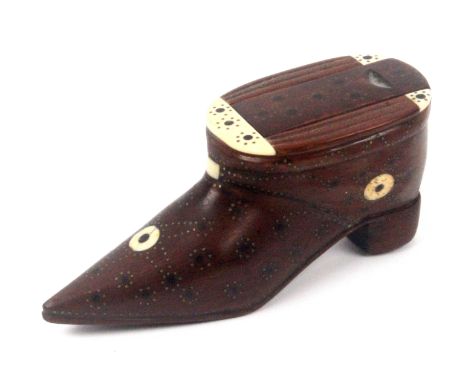 An elaborate mahogany shoe form snuff box, the sliding lid with ebony dots and brass pique work within conforming bone mounts