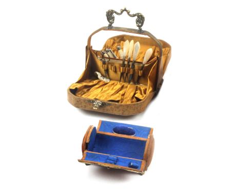 Two French leather and gilt brass mounted sewing 'bags', circa 1890, one embossed with flowers, gilt brass carrying handle an