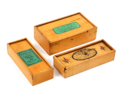 Three whitewood label decorated Tunbridge ware pen boxes, all rectangular with sliding lids comprising an example with black 