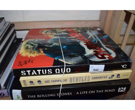 A mixed lot of large hardbound coffee table music books, to include: - The Complete Beatles Chronicle - Status Quo: Just Doin