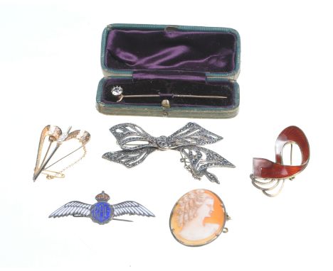 A collection of brooches 
Of various designs, to include; a bi-coloured 9ct gold stylised heart-shaped brooch, set with cultu