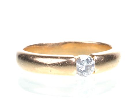 A diamond solitaire ring
The round brilliant-cut diamond to a tension style setting, yellow metal shank, diamond weight appro