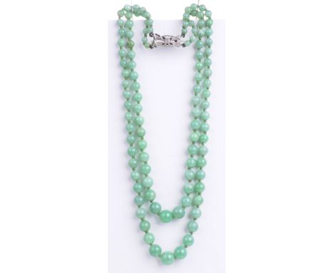 A two-row jade bead necklace
The graduating beads, from approximately 4.22mm to 9.96mm, to a 9ct white gold and rose cut diam