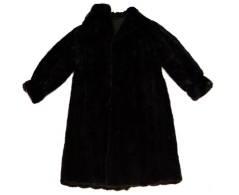 A ladies vintage black fur coat, possibly mink
The full length coat with narrow lapels and collar and full length wide and cu