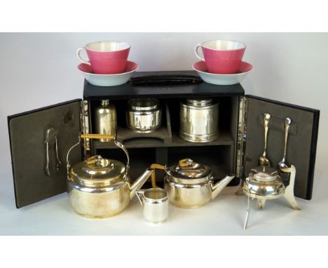 A French cased travelling teaset, Circa 1920s/30s 
The black leather case with hinged twin doors and carry handle, tooled wit